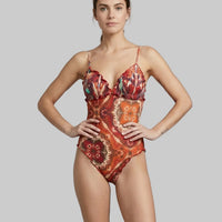 Elegante costume effek da bagno intero etnico rosso e arancione, scopri lo sconto speciale nel reparto outlet.